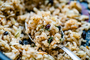 Turkish Stuffed Rice with Currants for Preparing Dolma in Pan with Spoon / Pilav or Pilaf