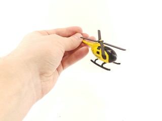 Toy helicopter yellow on white background