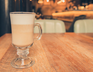 cup of coffee on wooden table