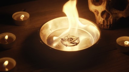 Burning pentacle on altar closeup photo