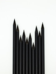 black pencils on a white background