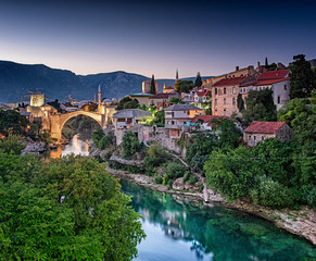 Fototapeta na wymiar Colorful sunset over the medieval bridge of Mostar 