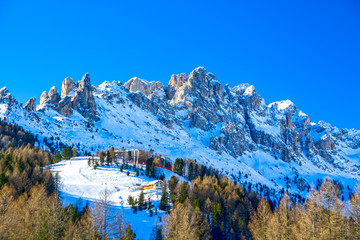 Dolomites mountain range ski slope, Vigo di Fassa resort, Italy, 