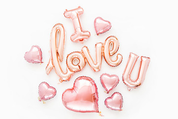 Pale pink Foil Balloons in the shape of the word 