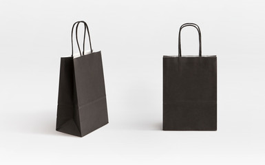 two very small black paper bag