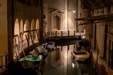 old town street and a picturesque water canal in venice