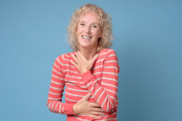 Caucasian beautiful laughing woman with blonde hair laughing on great joke. Positive facial human...