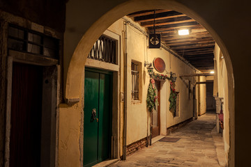 narrow street in old town of  Venice,beautiful arch at the beginning of the alley 