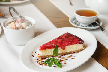 A piece of delicious cheese cake with cornel. Healthy food.