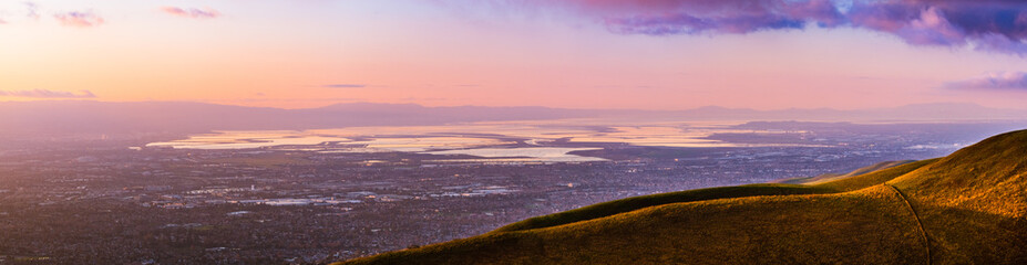 Panoramic sunset view of South San Francisco Bay Area also known as Silicon Valley; industrial and...