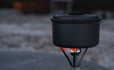 The gas burner heats the water in the bowler