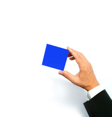 concept image of a businessman's hand in a gesturing pose - holding/showing a blue color card