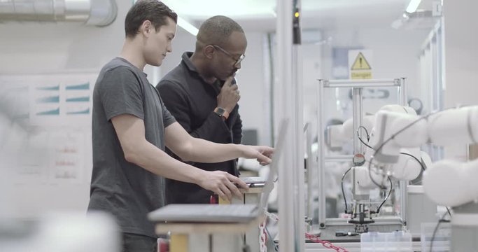 Robotics student with teacher