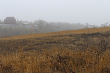 Fototapeta premium Beautiful rural landscape on the horizon against the background of hills
