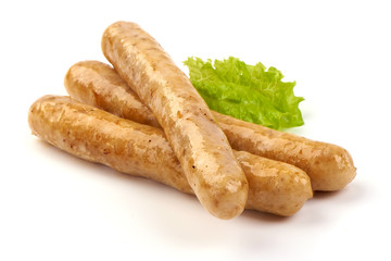 Grilled barbecue chicken sausages, isolated on white background