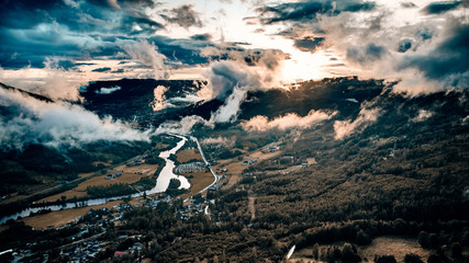 Drone shot over a deep valley. Low hanging clouds and fog makes the magic here. Shot in Hallingdal, Gol in Norway © SteinOve