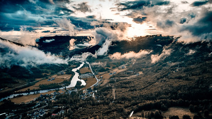 Drone shot over a deep valley. Low hanging clouds and fog makes the magic here. Shot in Hallingdal,...