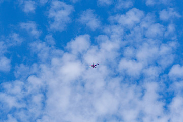 Commercial passenger airplane in the blue sky