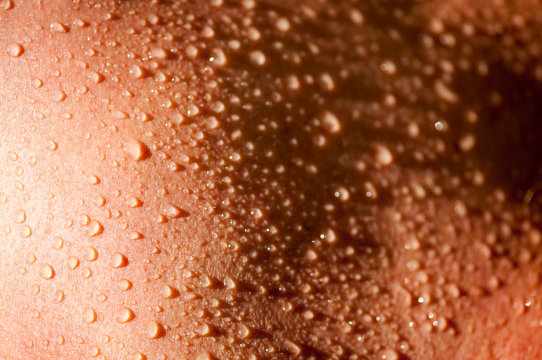 Full frame background of water drops collected on smooth skin