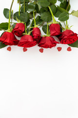 Top view of red rosese on white background