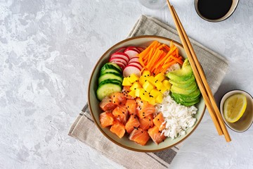 Top view of poke bowl with vegetables, rice and salmon - obrazy, fototapety, plakaty