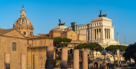Beautiful travel photo of Rome - dome of basilica and Victor Emmanuel II National Monument during nice sunny weather.