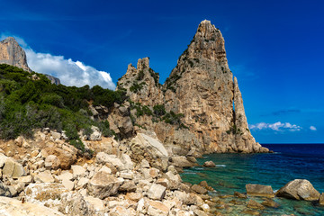Pedra Longa in Baunei - beautiful rocky beach in Sardinia. Beautiful weather and beautiful beach in Ogliastra, Sardiniam Italy