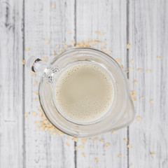 Portion of fresh Oat Milk (selective focus; close-up shot)