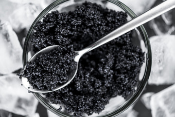 Some fresh Black Caviar (selective focus; close-up shot)