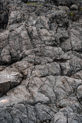 Close-up rock formation with cracks, background texture