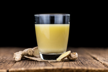 Portion of Ginger Juice as detailed close-up shot; selective focus