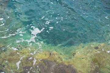 Fototapeta na wymiar pitfalls deep in turquoise water