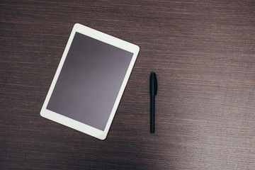 diary and tablet in the workplace