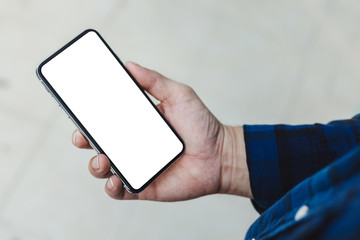 Mockup image blank white screen cell phone.man hand holding texting using mobile.background empty space for advertise text.people contact marketing business,technology 
