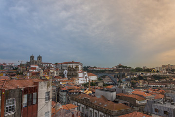 Fototapeta na wymiar Oporto, Portugal skyline, old buildings, churches and Dom Luis iron bridge in background