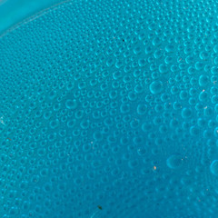 Blue water drops background close up