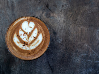 Mocha coffee on wooden table background.