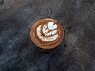 Mocha coffee on wooden table background.