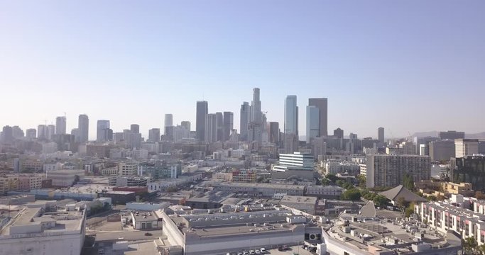 4k drone aerial downtown los angeles with traffic, bikes, skyline, city hall, police building