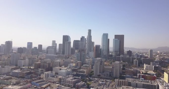 4k drone aerial downtown los angeles with traffic, bikes, skyline, city hall, police building