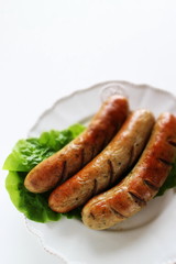 grilled pork sausage on lettuce with copy space