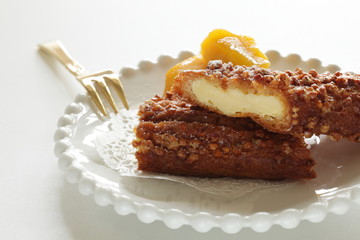 Crispy puff cream in half served with mango