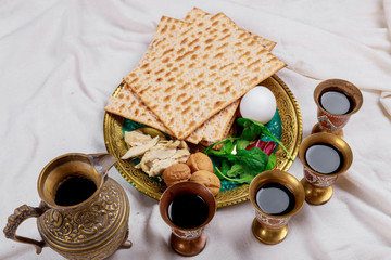Obraz na płótnie Canvas Passover matzoh jewish holiday bread with kiddush four cup of wine