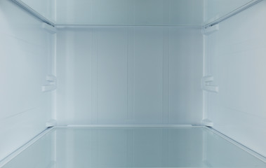 Shelf of empty modern refrigerator, closeup view
