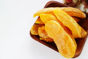 Dried mango from from vietnam on wooden plate