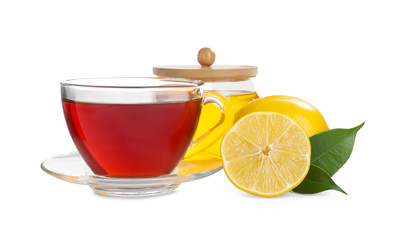 Fresh tea with honey and lemon on white background