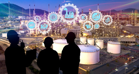 The silhouette of engineering teams is working at oil refinery as concept of industry 4.0