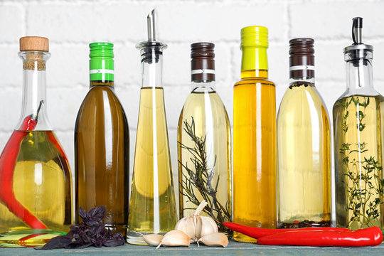 Different Cooking Oils On Blue Wooden Table