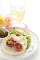 toasted English muffin and salami with cheese