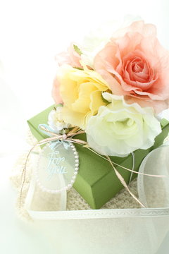Artificial flower and gift box with ribbon for holiday image